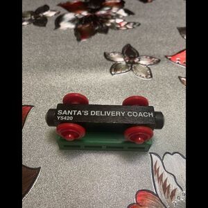 SANTA’S DELIVERED COACH CAR